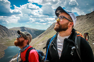 friends hiking with nose sunblock on